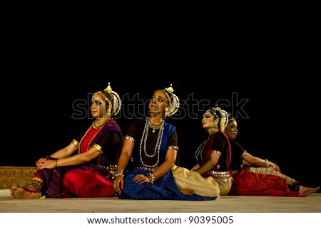 KONARK, INDIA - DECEMBER 04: An unidentified group of lady dancers wears traditional costume and performs Odissi dance at Konark temple on December 04, 2011 in Konark, Orissa, India
