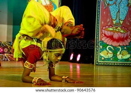 BHUBANESWAR, INDIA - NOVEMBER 24: An unidentified male dancer wears traditional ladies costume and performs Gotipua dance at Rabindra Mandap on November 24, 2011 in Bhubaneswar, India