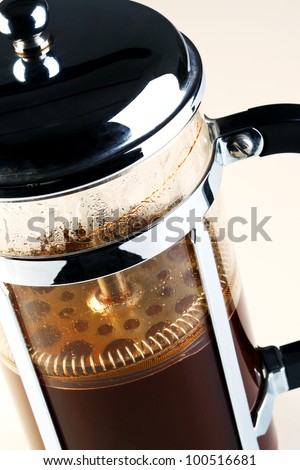 Photo of a Cafetiere with freshly brewed coffee inside, this is also know as a French press, Coffee plunger, Coffee press or Caffettiera.
