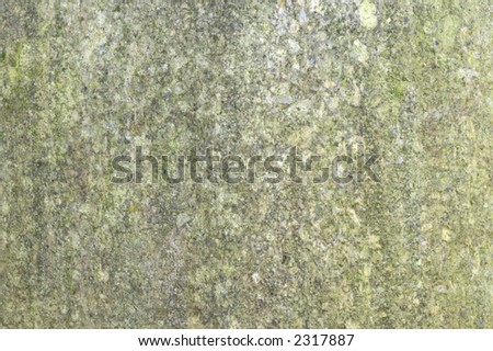 Closeup image of some weathered granite on a statue, suitable for backgrounds