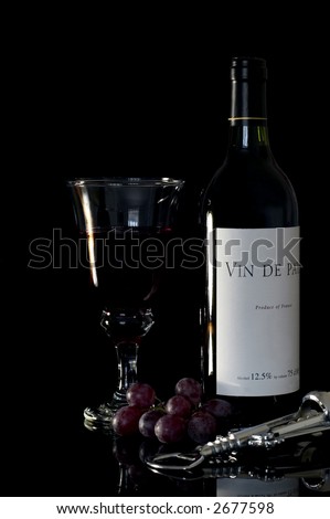 Wine still life against a black background. Vin de Pays (Country Wine)