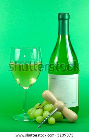 White wine bottle,glass grapes and corkscrew on a green background. Blank wine label.
