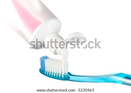 Blue toothbrush and toothpaste, isolated on white.
