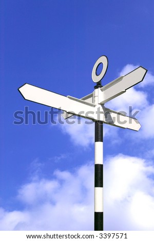 Blank road sign against a bright blue sky.