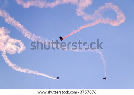 Smoke trails from a parachute display team.