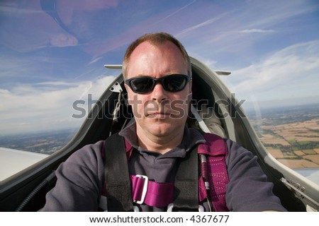 Man inside the cockpit of a glider at 3000 feet.