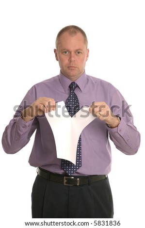 Businessman with a serious expression as he tears up a contract.
