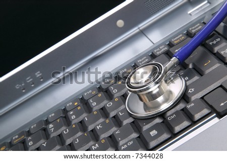 Computer health image of a stethoscope on a laptop keyboard.