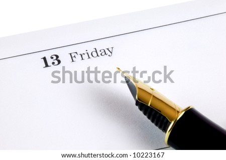 Friday 13th on a diary page with a gold nibbed fountain pen. Focal point is the date.