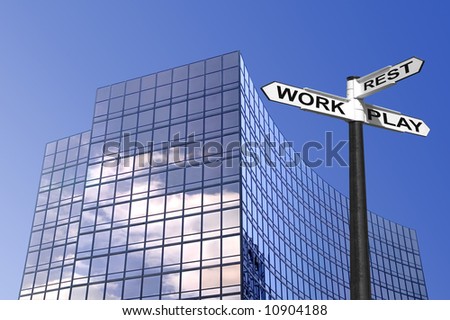 Concept image of a sign for Work Rest and Play outside a modern glass office building