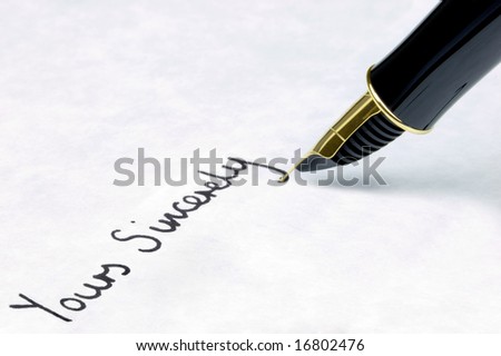 Yours Sincerely written on watermarked textured paper using a gold nibbed fountain pen. Focal point is on the text.