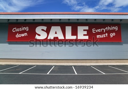 Retail building with a banner on the outside for a closing down sale. Good image for recession concepts.