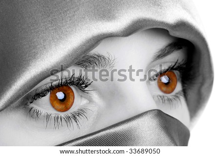 Abstract image of a woman wearing a headscarf which has been digitally enhanced to highlight her eyes, this is the natural colour of the models eyes.