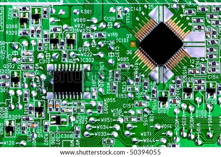 Close up of a circuit board and computer chips.