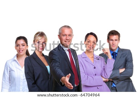 A manager offering to shake your hand with a business team behind, isolated on a white background.