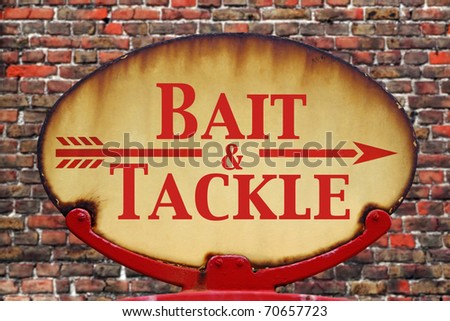 A rusty old retro arrow sign with the text Bait and Tackle