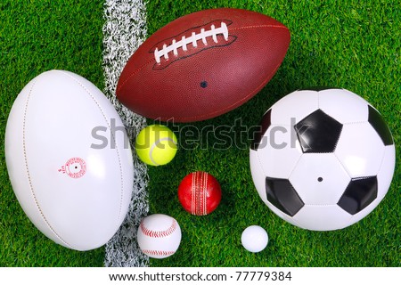 Photo of various sports balls on a grass next to the white line shot from above Photo of various sports balls on a grass next to the white line shot from above