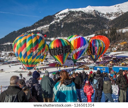 CHATEAU D\'OEX, SWITZERLAND - JANUARY 26TH 2013. Crowd at the 35th International Hot Air Balloon Festival, Switzerland on January 26th 2013 at Chateau d\'Oex, Switzerland.