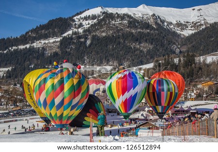 CHATEAU D\'OEX, SWITZERLAND - JANUARY 26: Hot air balloons at the 35th International Hot Air Balloon Festival, Switzerland on January 26, 2013 in Chateau d\'Oex, Switzerland.