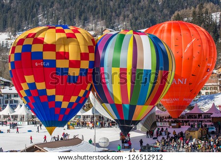 CHATEAU D\'OEX, SWITZERLAND - JANUARY 26: Hot air balloons at the 35th International Hot Air Balloon Festival, Switzerland on January 26, 2013 in Chateau d\'Oex, Switzerland.