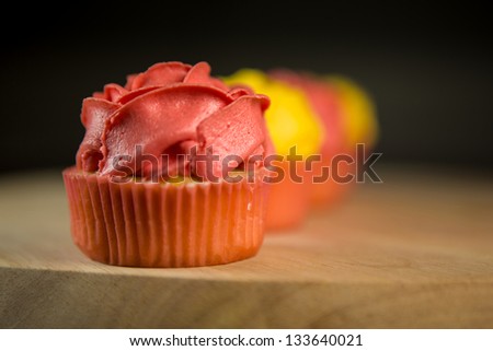 Rose shape cupcakes on a pastry board