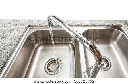 Water flowing from a kitchen faucet