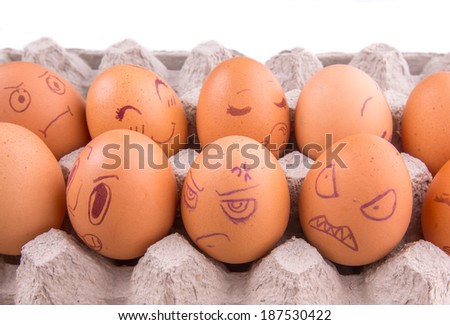Chicken eggs with drawn face emotions
