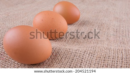 Chicken eggs on a gunny sack