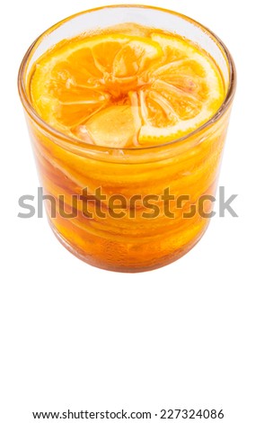 Home remedy of lemon slices and honey in a glass jar over white background