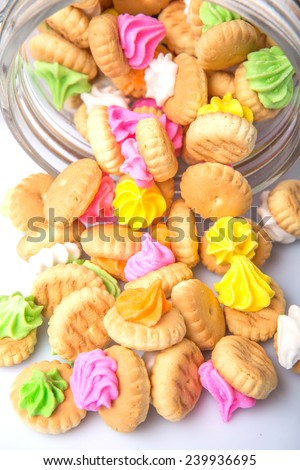 Belly button iced gem biscuits in a glass jar
