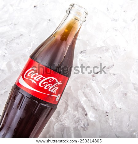 KUALA LUMPUR, MALAYSIA - FEBRUARY 5TH, 2015. Coca Cola soft drink on ice. Coca Cola drinks are produced and manufactured by The Coca-Cola Company, an American multinational beverage corporation