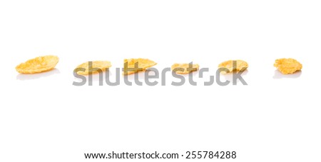 Corn flakes breakfast cereal over white background