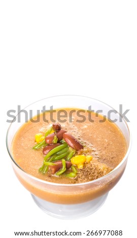 Cendol, a popular traditional dessert originating from Southeast Asia in a glass over white background.