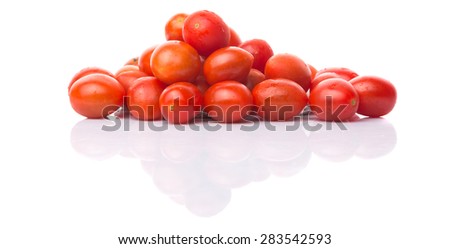 Bite sized red cherry grape tomato over white background