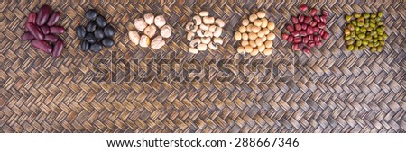 Black eye peas, mung bean, adzuki beans, soy beans, black beans and red kidney beans on wicker tray