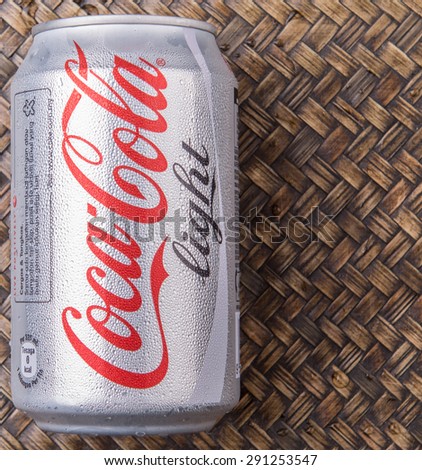 PUTRAJAYA, MALAYSIA - JUNE 28TH, 2015. Coca Cola Diet on wicker background. Coca Cola drinks are produced and manufactured by The Coca-Cola Company, an American multinational beverage corporation.