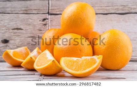 Orange fruit over weathered wooden background