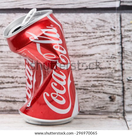 PUTRAJAYA, MALAYSIA - JULY 14TH, 2015. Crumpled Coca Cola cans. Coca Cola drinks are produced and manufactured by The Coca-Cola Company, an American multinational beverage corporation.