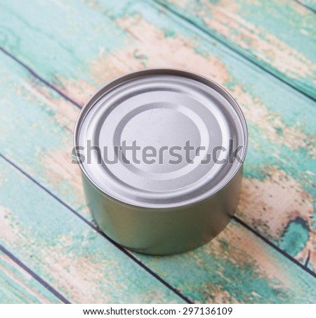 Short aluminum can over rustic weathered wooden background