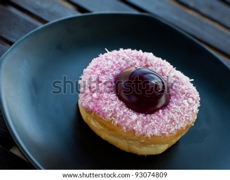 delicious  donut  on the disk in coffee break.
