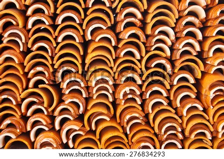 Layers of mass roof tiles Background.