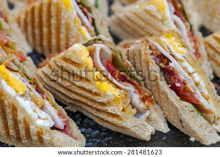 Mini sandwich bacon, ham and fried egg for party.