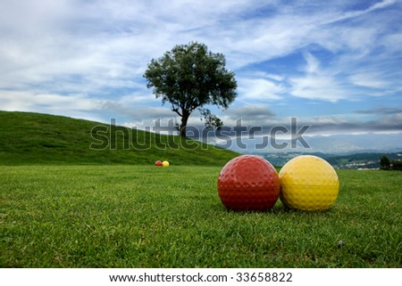 Area of play in the golf course and mountain with blue sky