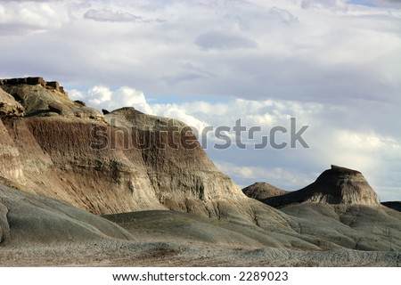 Hills of the western Painted Desert in Arizona beside highway 89 north of Flagstaff showing cloudy sky