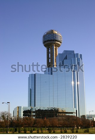 Dallas skyline and towers against blue sky at sunset