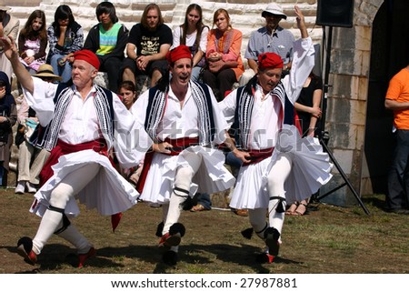 COSTA MESA, CA - APRIL 4 : Greek Syrtaki Folk Dance Ensemble of Orange County perform at the Anatolian Cultures and Food Festival at the Orange Country Fair Grounds April 4, 2009 in Costa Mesa, CA.