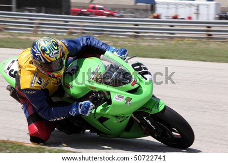 COLLEGE STATION, TX - APRIL 10:  Res Top 10 team bike negotiates turn nine in the six-hour endurance race for super bikes at Texas World Speedway April 10, 2010 in College Station, TX