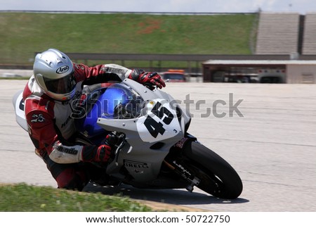 COLLEGE STATION, TX - APRIL 10: Moto-Ace team bike races to victory in the six-hour endurance race for super bikes at Texas World Speedway April 10, 2010 in College Station, TX