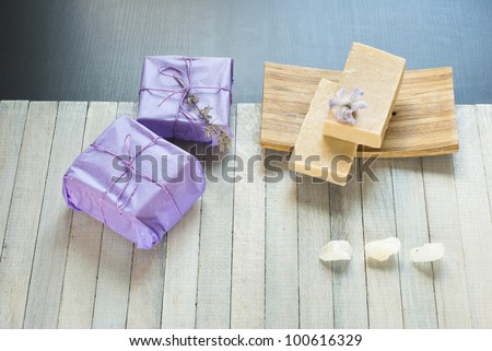 homemade soaps stack, bath salts and gift on wooden