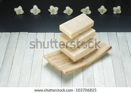 levitation jasmine soaps stack and jasmine flowers on wooden background
